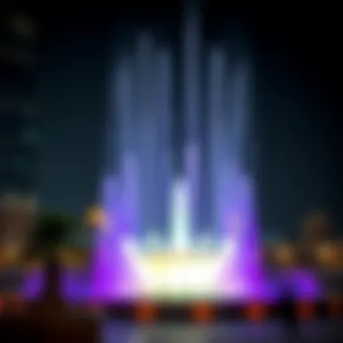 Stunning view of the Burj Khalifa fontaines at night illuminated by colorful lights