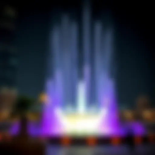 Stunning view of the Burj Khalifa fontaines at night illuminated by colorful lights