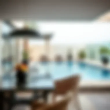 Stylish outdoor dining area next to a private pool