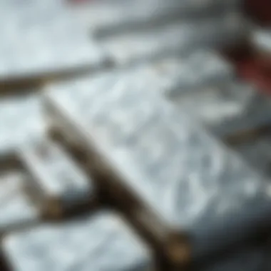 A close-up of a silver bar with intricate designs